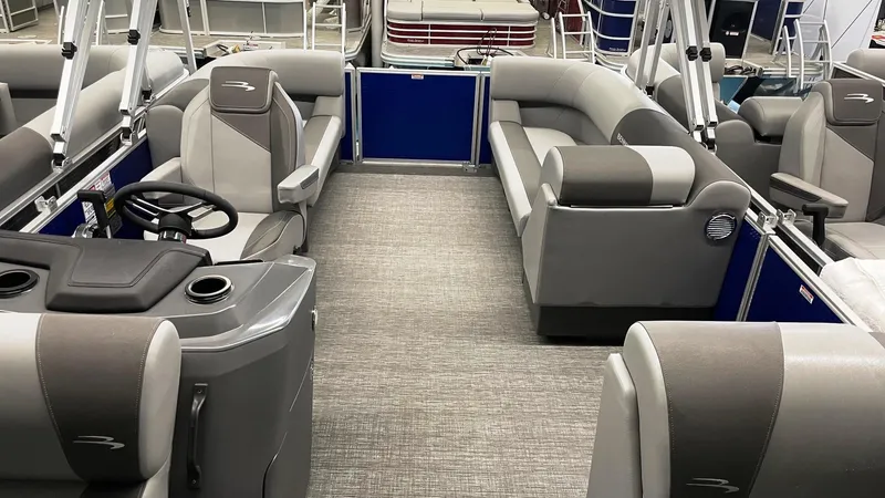 Slide: The Image of 2024 Bennington 20 SVSR pontoon boat interior with gray seating and modern design. - 3