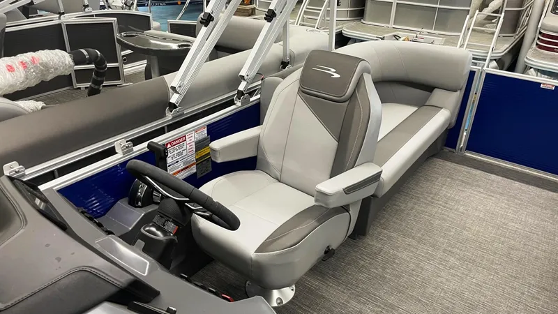 Slide: The Image of 2024 Bennington 20 SVSR boat interior with gray seating and steering console. - 5