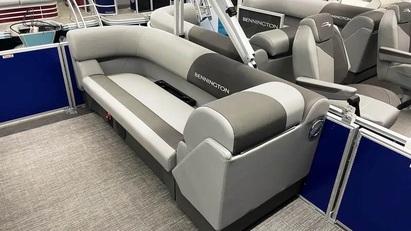 Slide: The Image of 2024 Bennington 20 SVSR pontoon boat interior with gray seating and modern design. - 6