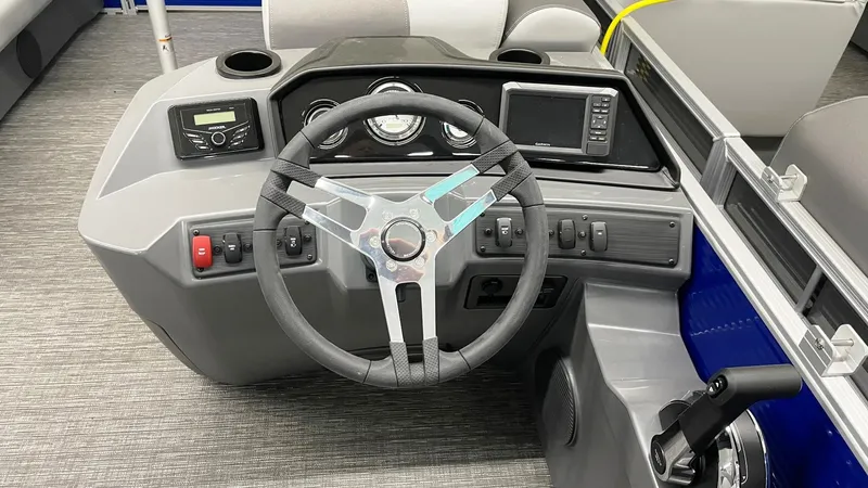 Slide: The Image of 2024 Bennington 20 SVSR boat dashboard with steering wheel and control panel. - 7