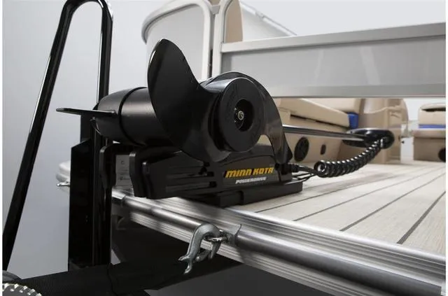 Slide: The Image of 2023 SunCatcher Select 322FC boat interior with captain's chair and control console. - 7