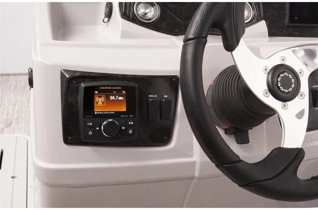 Slide: The Image of 2023 SunCatcher Select 322FC boat interior with seating and storage compartments. - 9