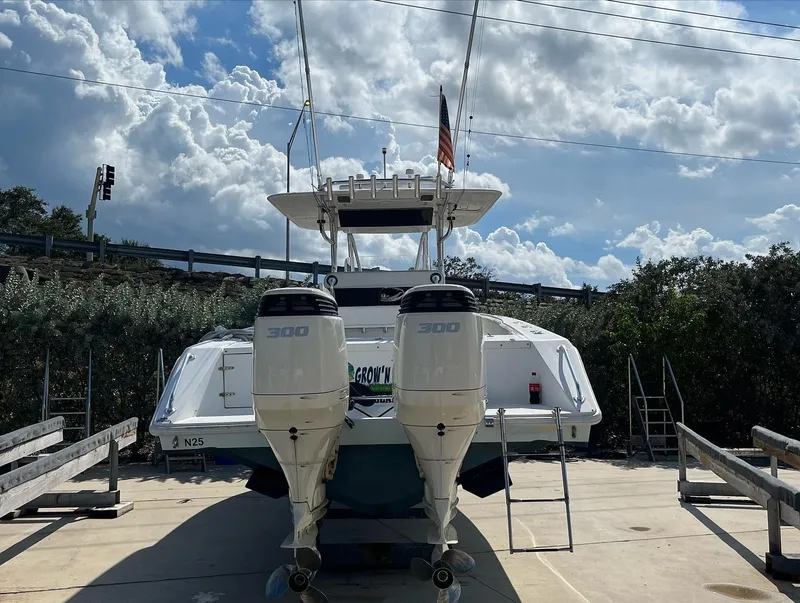 Slide: The Image of 2004 Venture 34 Center Console boat with twin 300 horsepower engines. - 3