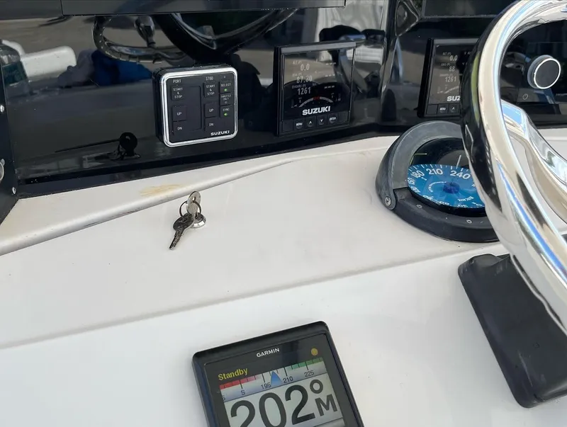 Slide: The Image of Close-up of the dashboard of a 2004 Venture 34 Center Console boat. - 9