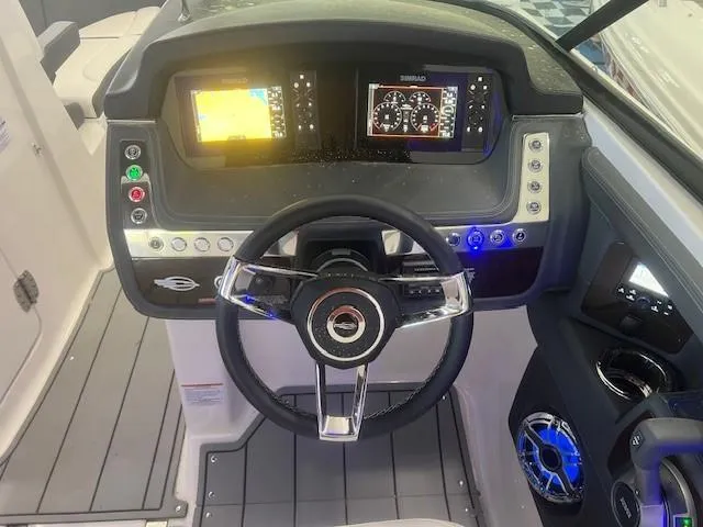 Slide: The Image of 2024 Chaparral 26 Surf cockpit with modern instruments. - 12