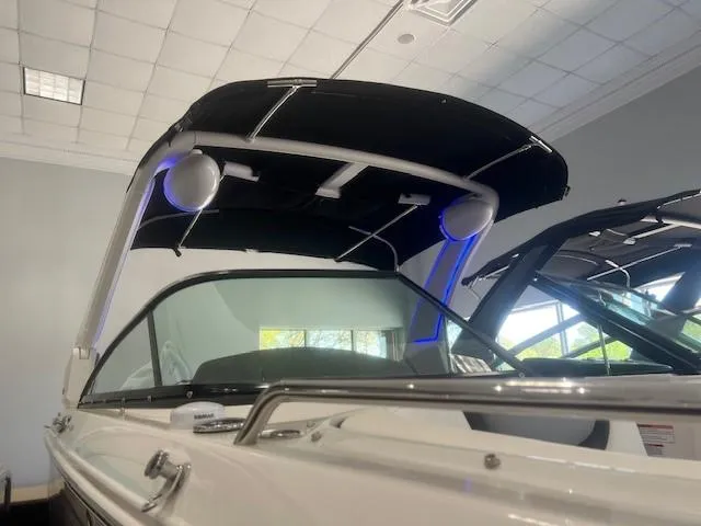 Slide: The Image of 2024 Chaparral 26 Surf boat with sleek design and features. - 13