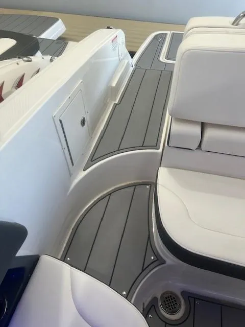 Slide: The Image of Interior of 2024 Chaparral 26 Surf with gray and white seating. - 14