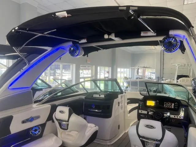 Slide: The Image of Interior view of 2024 Chaparral 26 Surf boat with modern features. - 15