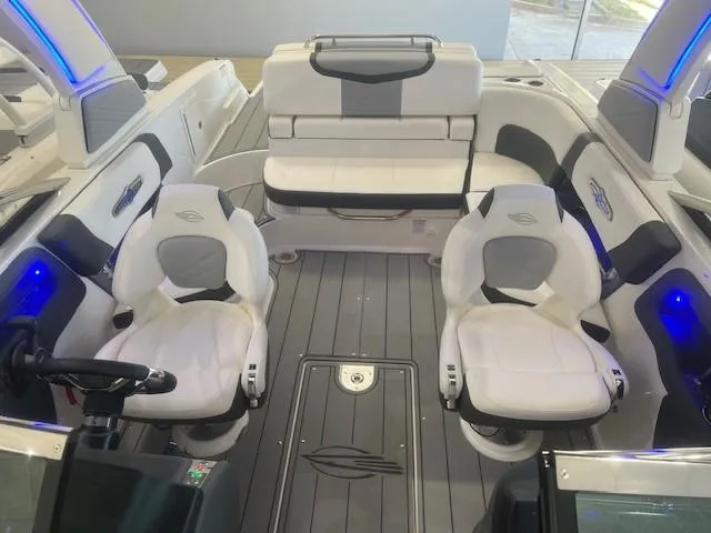 Slide: The Image of Interior of 2024 Chaparral 26 Surf with modern seating and lighting. - 17