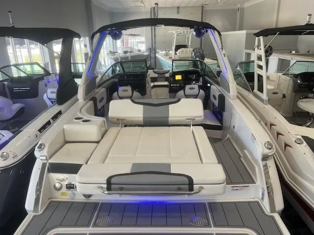 Slide: The Image of Interior view of 2024 Chaparral 26 Surf boat in showroom. - 6