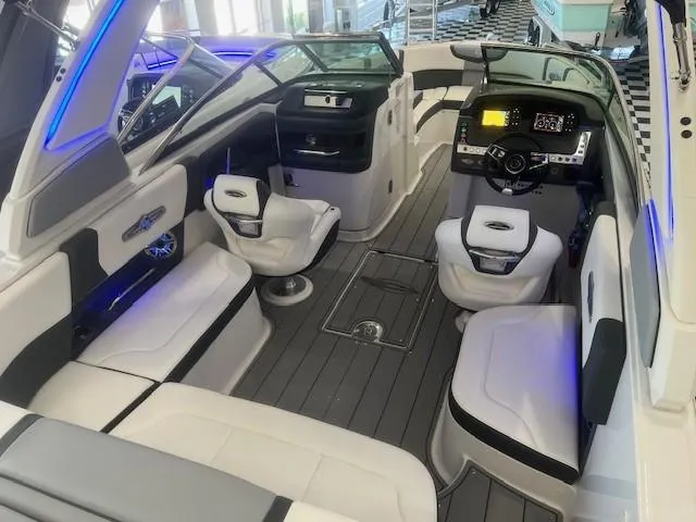 Slide: The Image of Interior of 2024 Chaparral 26 Surf boat with luxurious features. - 7