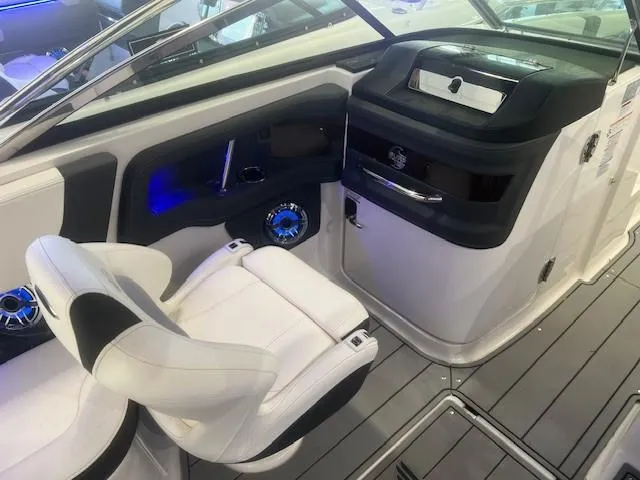 Slide: The Image of Interior of 2024 Chaparral 26 Surf with modern cockpit and seating. - 9