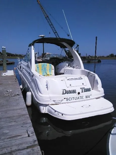 Slide: The Image of 2001 Sea Ray 280 Sundancer docked in Scituate, MA, with a sunny backdrop. - 3