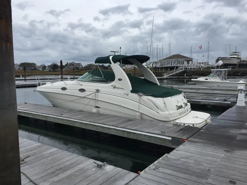 Slide: The Image of 2001 Sea Ray 280 Sundancer docked at a marina under cloudy skies. - 5