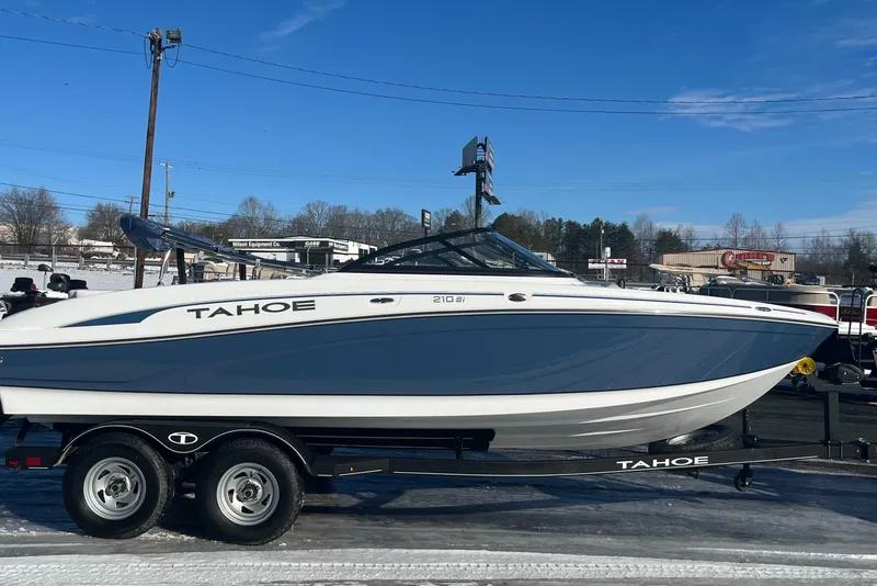 The Image of 2024 Tahoe 210 Si boat on trailer in outdoor lot. - 0