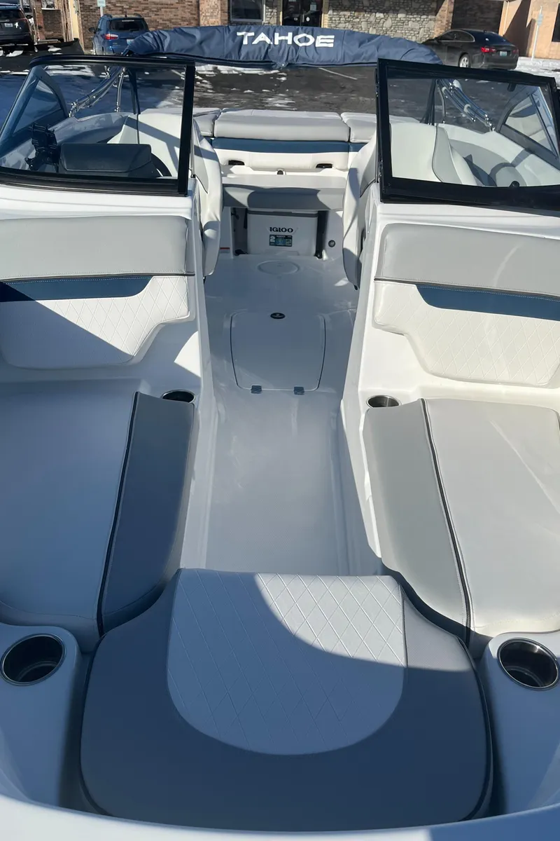 Slide: The Image of 2024 Tahoe 210 Si boat interior with seating and cup holders. - 12