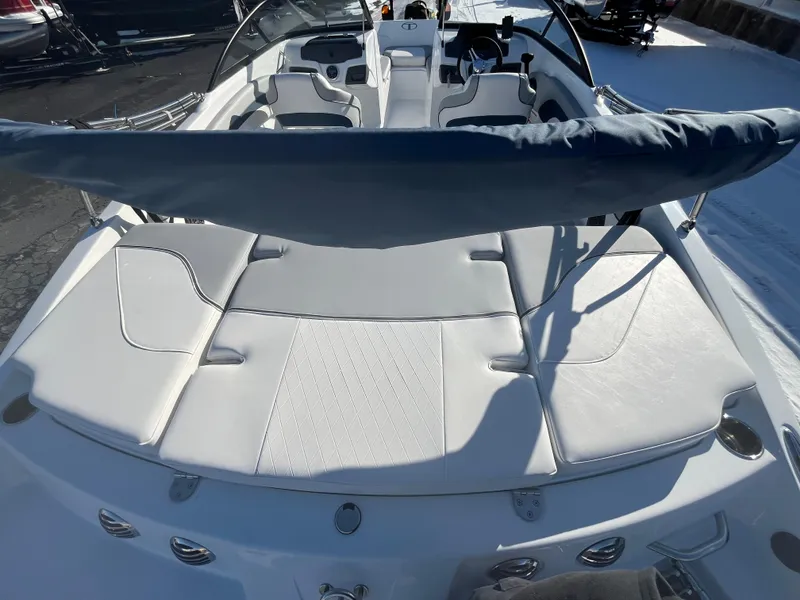 Slide: The Image of 2024 Tahoe 210 Si boat with white leather seating and sunshade. - 3