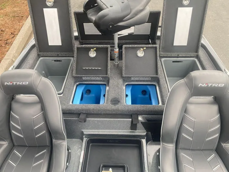 Slide: The Image of 2024 Nitro Z21 XL Pro boat interior with storage compartments and seating. - 10