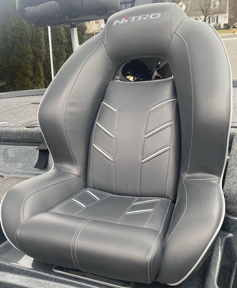 Slide: The Image of 2024 Nitro Z21 XL Pro boat seat with sleek black design. - 13