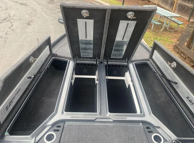 Slide: The Image of 2024 Nitro Z21 XL Pro boat storage compartments open, showcasing spacious interior. - 20