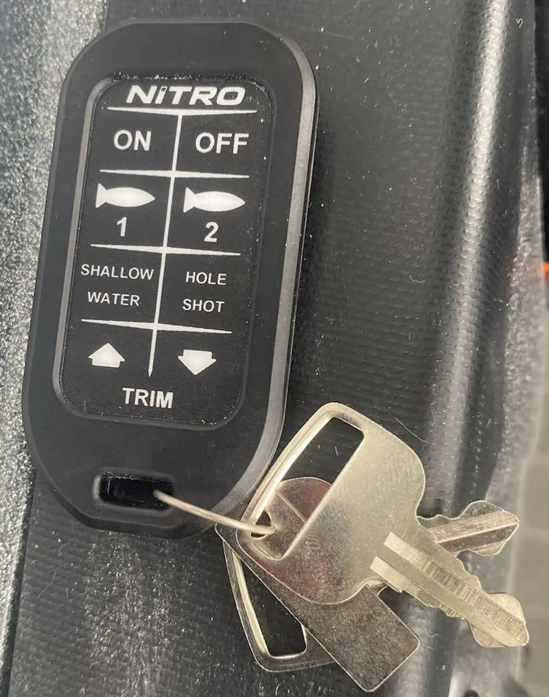 Slide: The Image of 2024 Nitro Z21 XL Pro boat key fob with trim and water settings. - 23