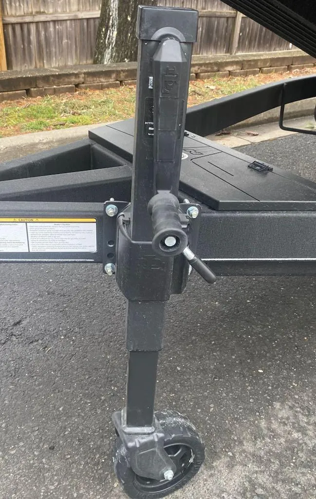 Slide: The Image of 2024 Nitro Z21 XL Pro trailer jack on pavement. - 29