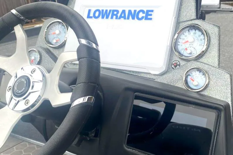 Slide: The Image of 2024 Nitro Z21 XL Pro boat dashboard with Lowrance display and gauges. - 6