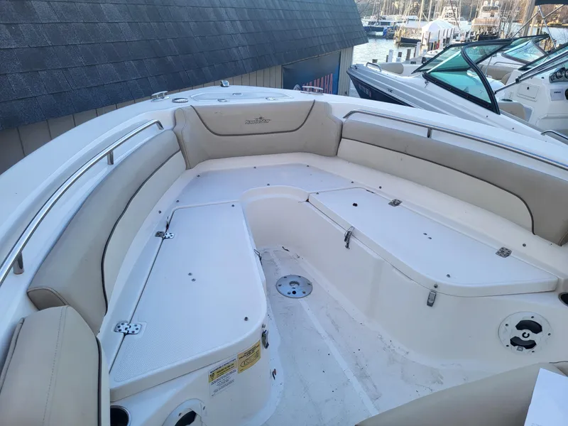 Slide: The Image of 2021 NauticStar 2302 Legacy boat with spacious seating and storage compartments. - 20