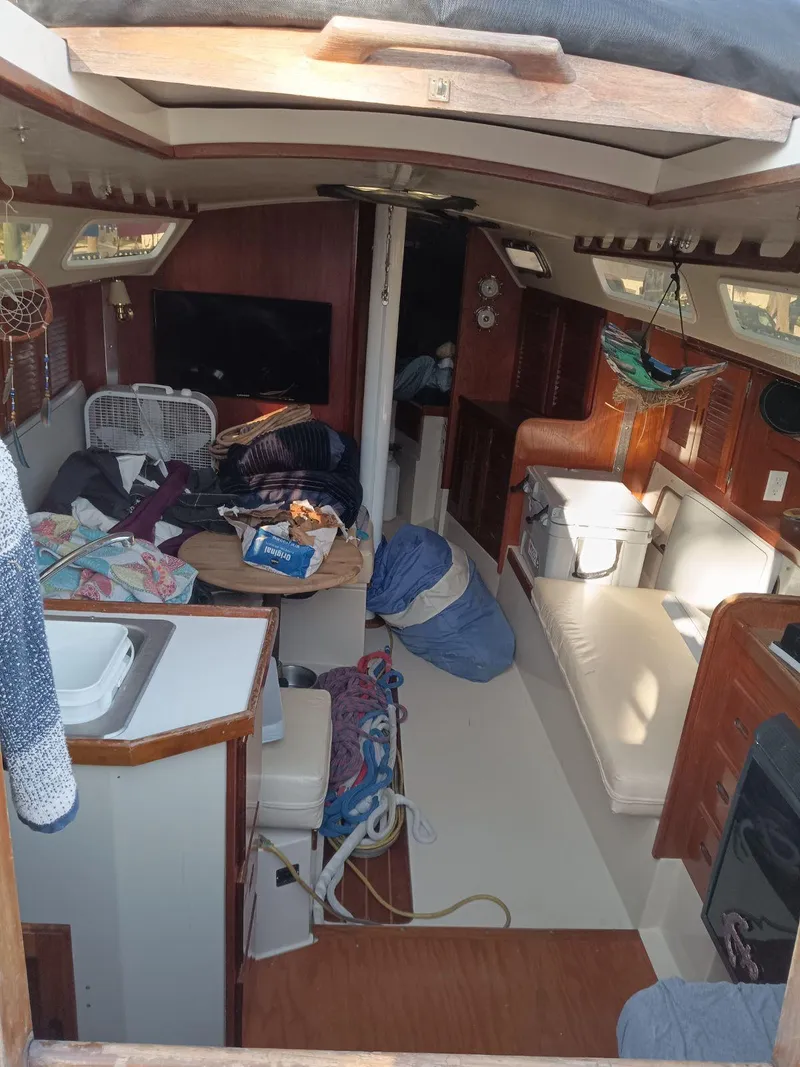 Slide: The Image of Interior of a 1985 Catalina 38 sailboat with cozy seating and nautical decor. - 2