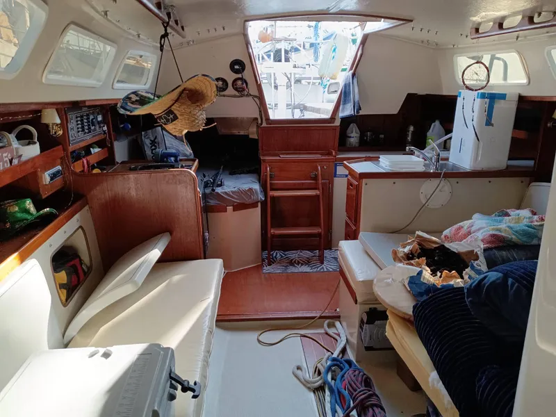 Slide: The Image of Interior of a 1985 Catalina 38 sailboat with cozy seating and nautical decor. - 8