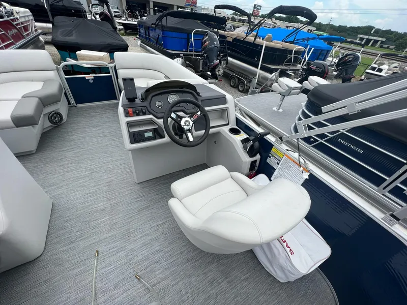 Slide: The Image of 2023 Godfrey Sweetwater Xperience 1680 CX pontoon boat interior with helm and seating. - 11