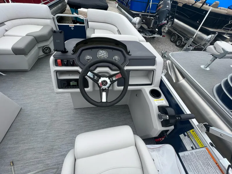 Slide: The Image of 2023 Godfrey Sweetwater Xperience 1680 CX pontoon boat interior with steering console and seating. - 12