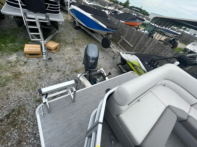 Slide: The Image of 2023 Godfrey Sweetwater Xperience 1680 CX pontoon boat with Yamaha 60 HP outboard motor. - 14
