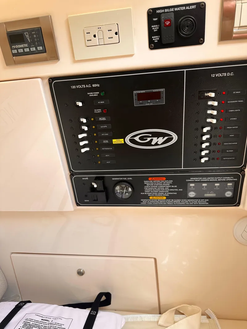 Slide: The Image of 2019 Grady-White Freedom 325 control panel with electrical switches and indicators. - 12
