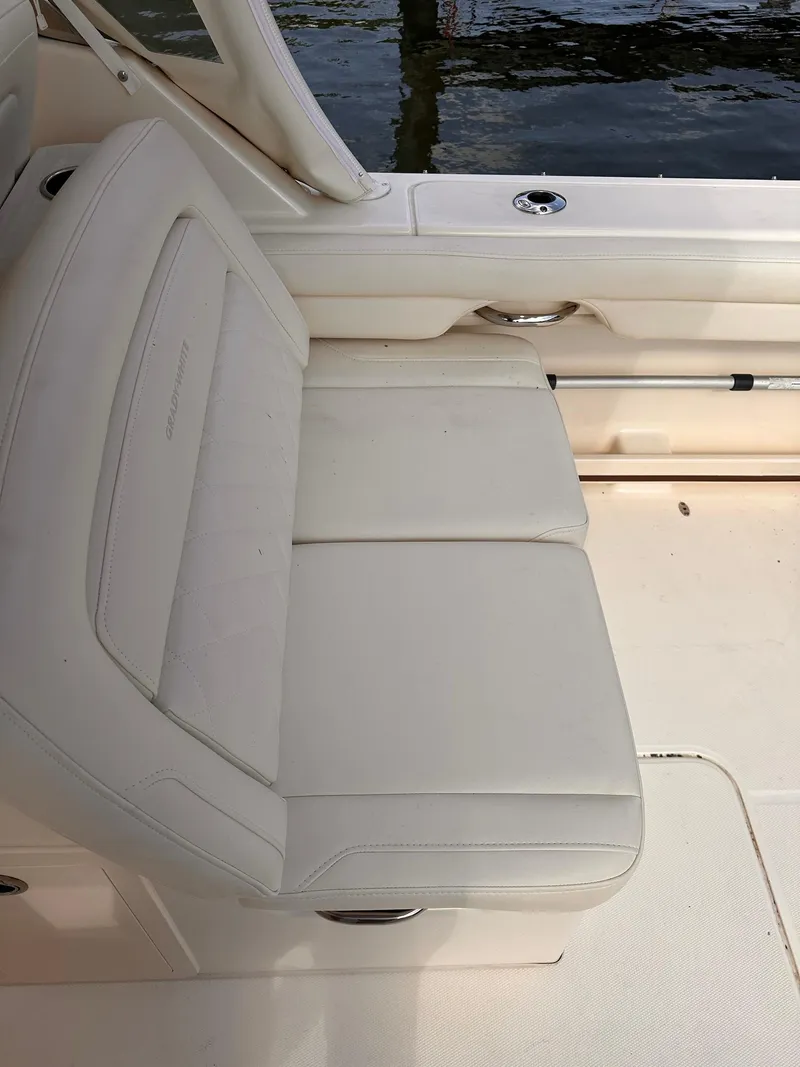 Slide: The Image of 2019 Grady-White Freedom 325 boat seat with white upholstery. - 14