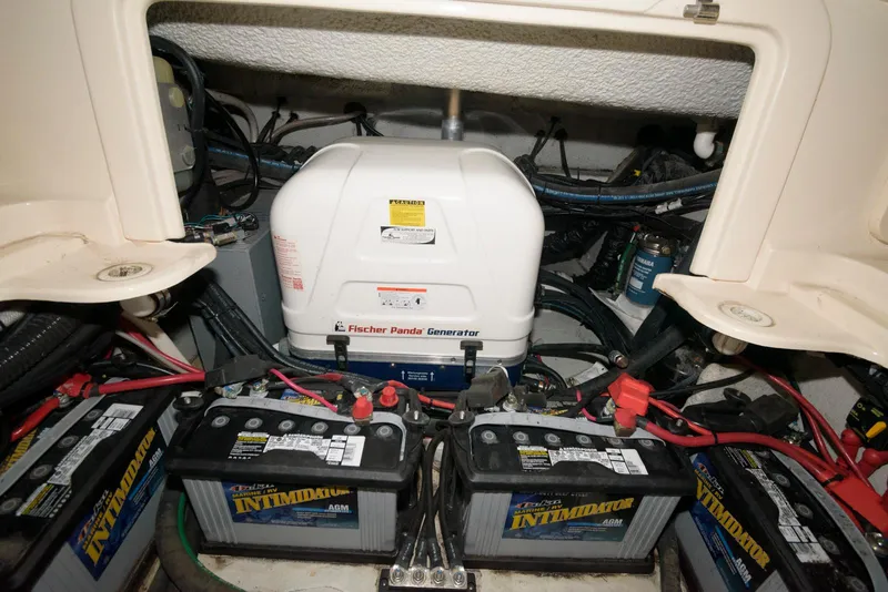 Slide: The Image of 2019 Grady-White Freedom 325 boat engine compartment with batteries and Fischer Panda generator. - 18