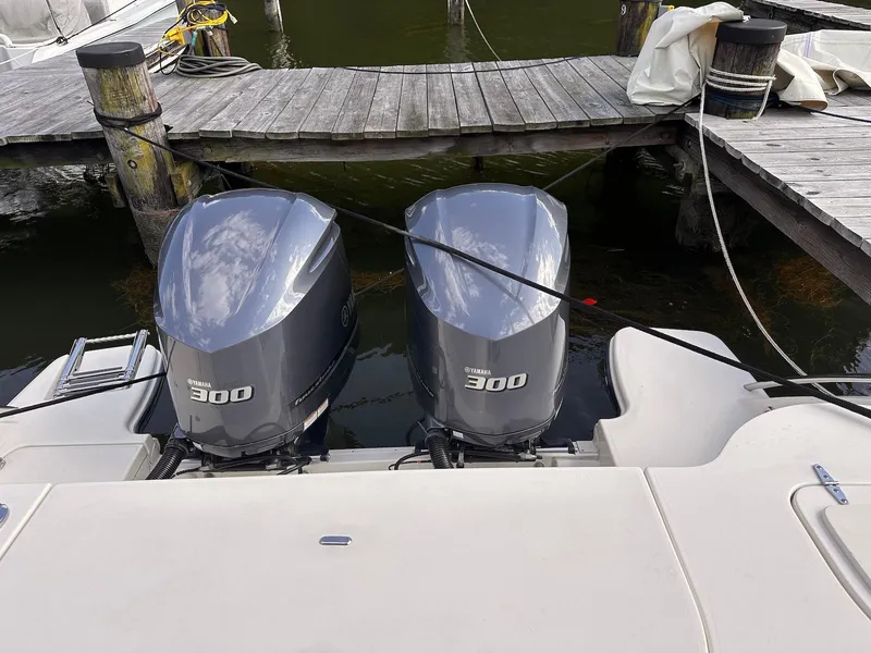 Slide: The Image of Twin Yamaha 300 outboard engines on a 2019 Grady-White Freedom 325 boat at dock. - 19