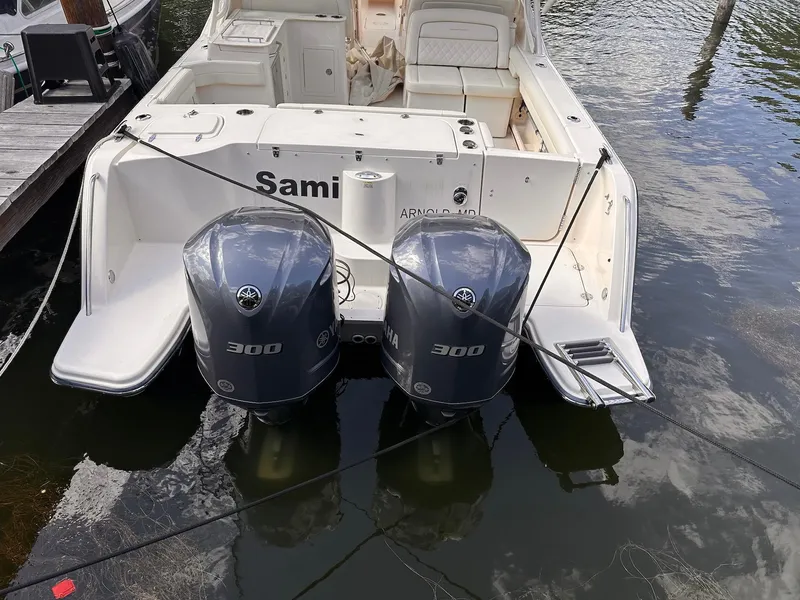 Slide: The Image of 2019 Grady-White Freedom 325 boat with twin Yamaha 300 engines docked. - 2