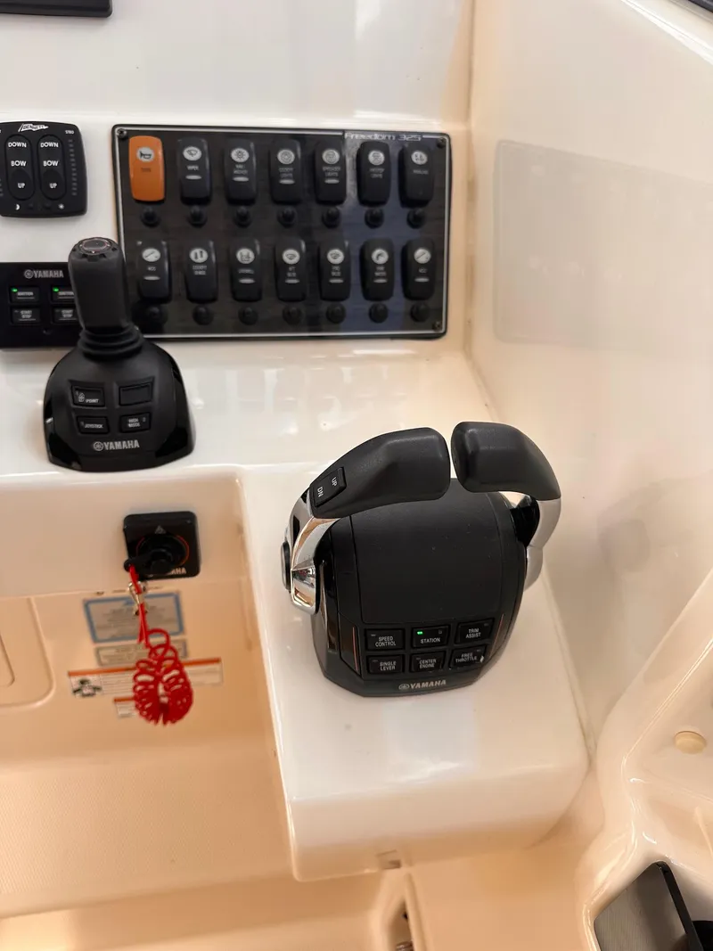 Slide: The Image of 2019 Grady-White Freedom 325 boat control panel with Yamaha throttle and joystick. - 5