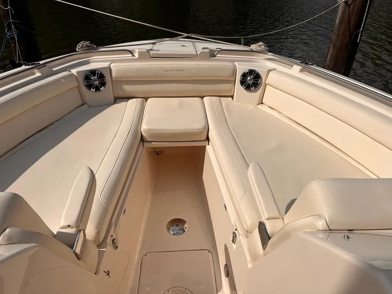 Slide: The Image of 2019 Grady-White Freedom 325 boat interior with cushioned seating. - 6