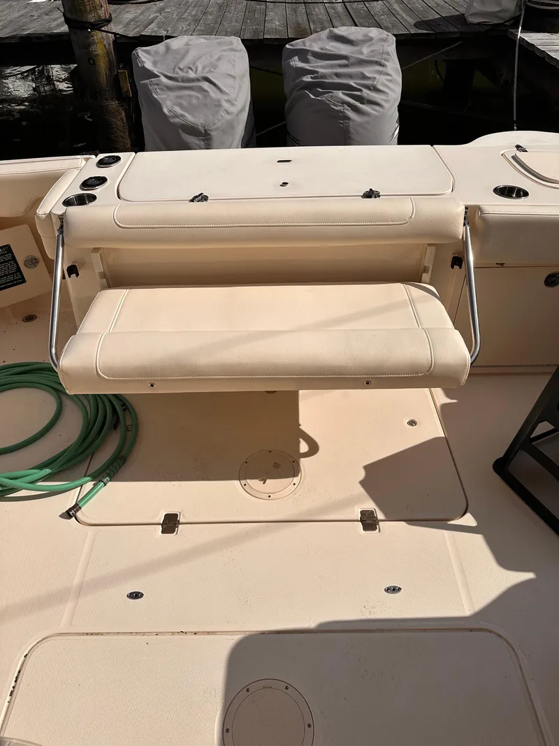 Slide: The Image of 2019 Grady-White Freedom 325 boat interior with foldable bench seat. - 9