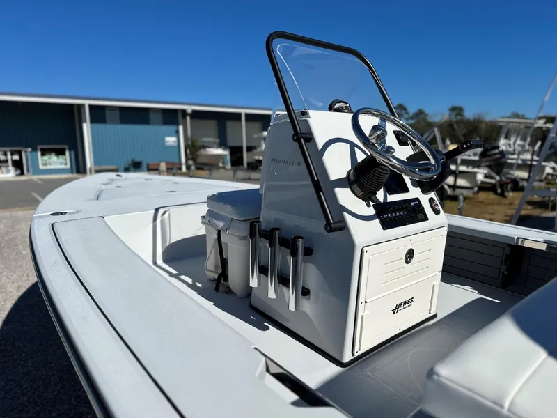 Slide: The Image of 2024 Hewes 18 Redfisher boat with center console and steering wheel. - 11