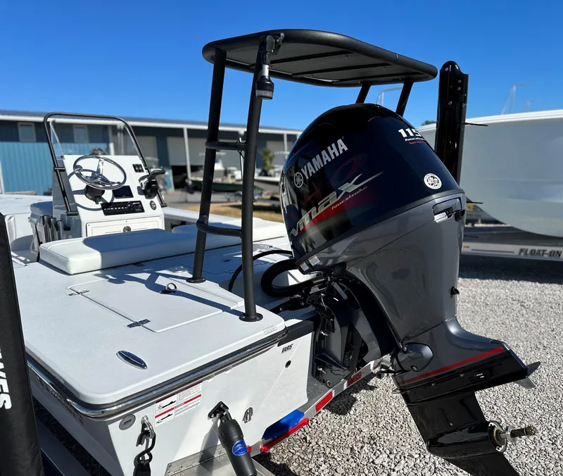 Slide: The Image of 2024 Hewes 18 Redfisher boat with Yamaha 115 VMAX engine, rear view. - 12