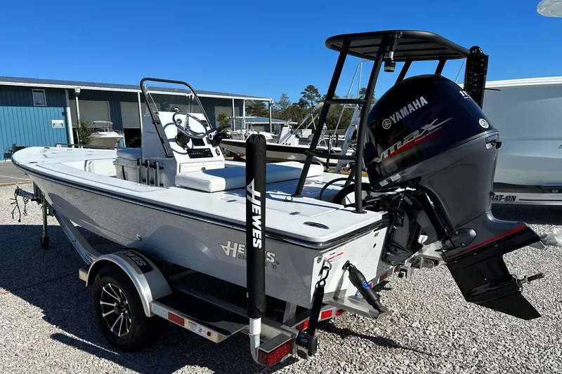 Slide: The Image of 2024 Hewes 18 Redfisher boat with Yamaha outboard motor on trailer. - 3