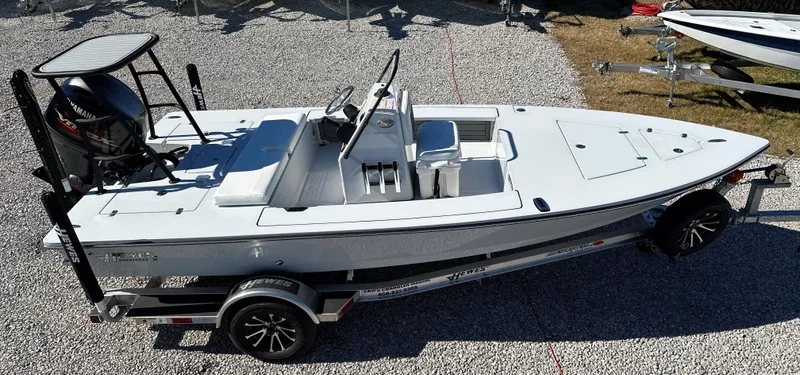 Slide: The Image of 2024 Hewes 18 Redfisher boat on a trailer, top view. - 8
