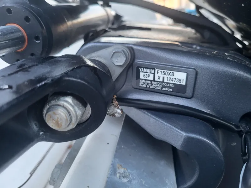 Slide: The Image of Close-up of Yamaha F150XB engine on 2020 NauticStar 223DC Sport Deck boat. - 2