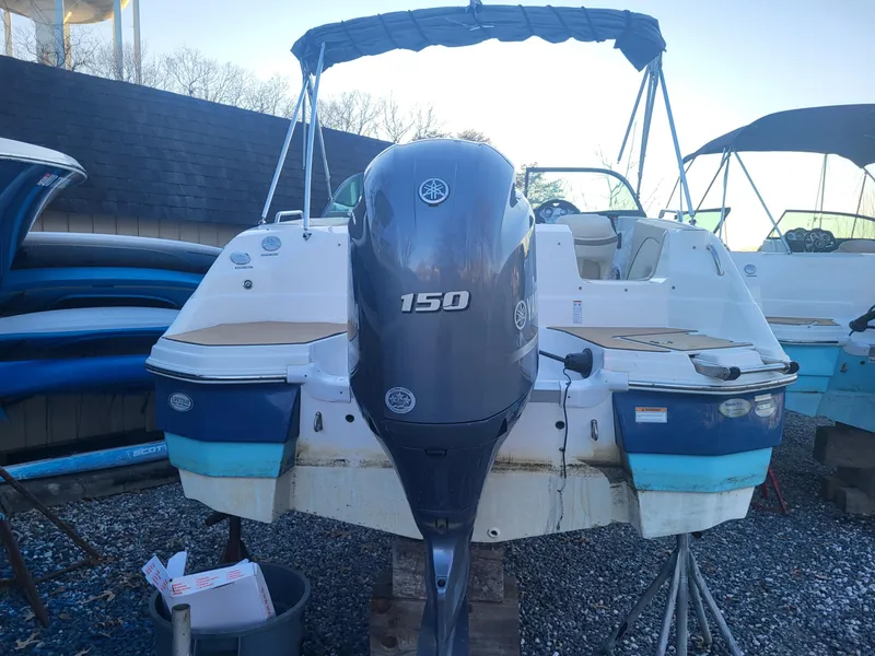 Slide: The Image of 2020 NauticStar 223DC Sport Deck boat with Yamaha 150 outboard motor. - 3