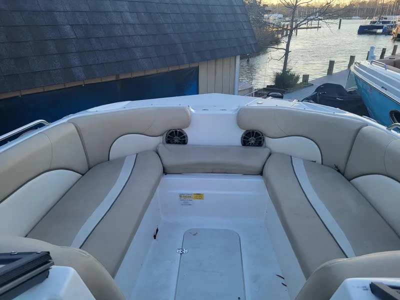 Slide: The Image of 2020 NauticStar 223DC Sport Deck boat interior with beige seating. - 4