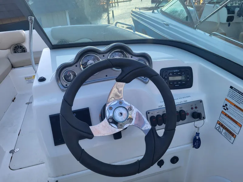 Slide: The Image of 2020 NauticStar 223DC Sport Deck boat steering console with gauges and controls. - 7