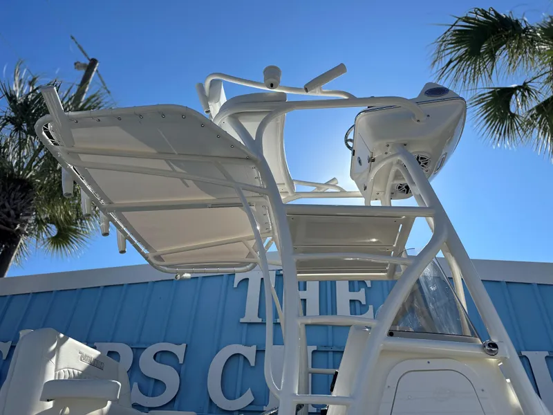 Slide: The Image of 2025 Pathfinder 2400 Open boat tower against blue sky and palm trees. - 11